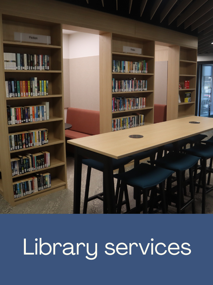 Photo of the library welcome desk. Click to open the Library Services webpage.